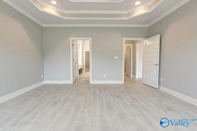 17401 Stonegate Dr, Athens, AL 35613 - unfurnished bedroom featuring a tray ceiling, ornamental molding, light wood-type flooring, baseboards, and recessed lighting