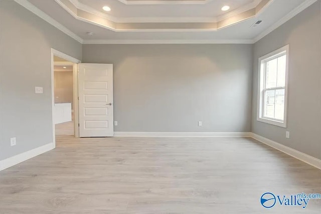 17401 Stonegate Dr, Athens, AL 35613 - unfurnished room with a raised ceiling, crown molding, light wood-type flooring, recessed lighting, and baseboards