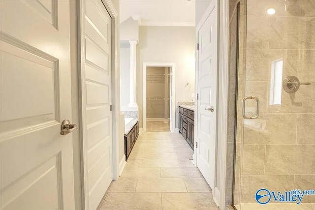 17401 Stonegate Dr, Athens, AL 35613 - bathroom with a stall shower, decorative columns, vanity, a walk in closet, and tile patterned flooring
