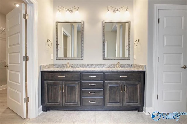 17401 Stonegate Dr, Athens, AL 35613 - full bathroom featuring baseboards, double vanity, and a closet
