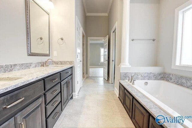17401 Stonegate Dr, Athens, AL 35613 - bathroom with ornamental molding, a bath, double vanity, ornate columns, and tile patterned floors