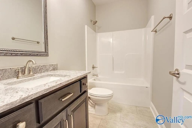 17401 Stonegate Dr, Athens, AL 35613 - bathroom with toilet, vanity, tile patterned floors, and bathing tub / shower combination