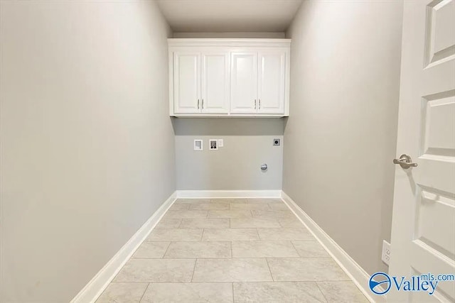 17401 Stonegate Dr, Athens, AL 35613 - washroom with hookup for an electric dryer, cabinet space, washer hookup, light tile patterned floors, and baseboards