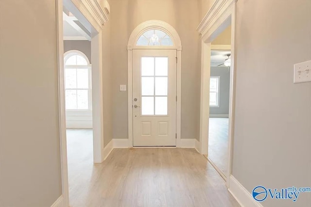 17401 Stonegate Dr, Athens, AL 35613 - foyer featuring light wood finished floors, healthy amount of natural light, ceiling fan, and baseboards