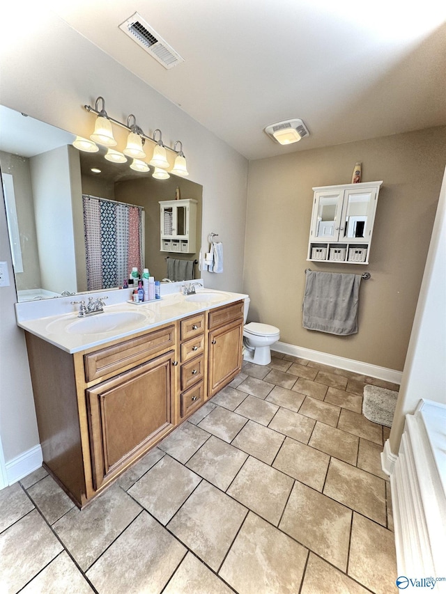 full bath featuring double vanity, a sink, and visible vents