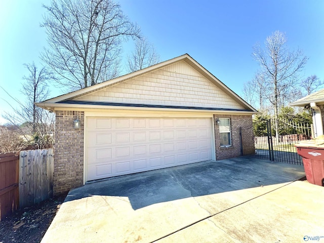 detached garage featuring fence