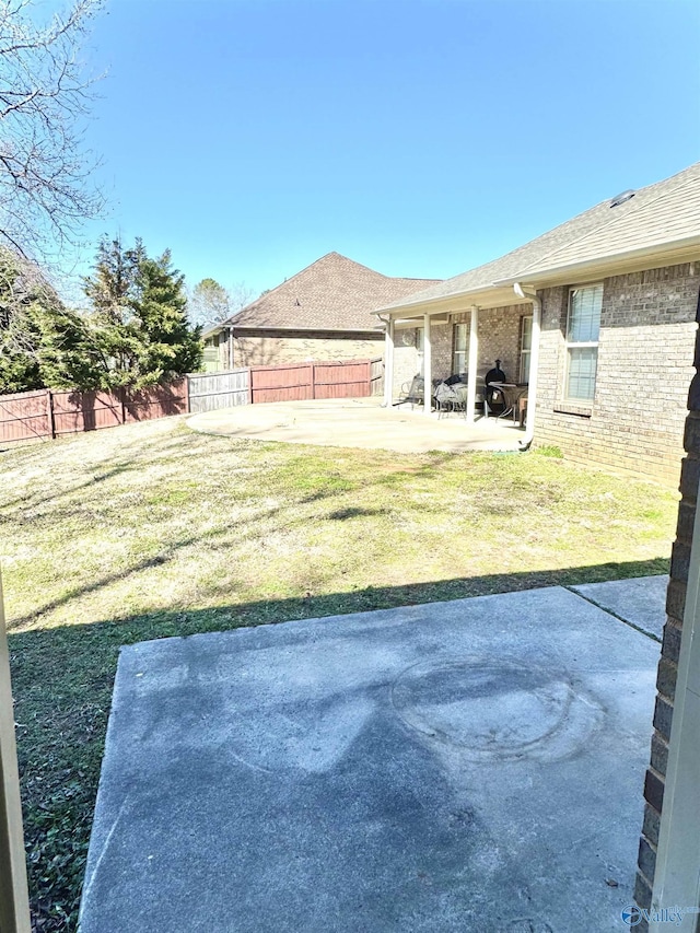 view of yard featuring a patio and a fenced backyard