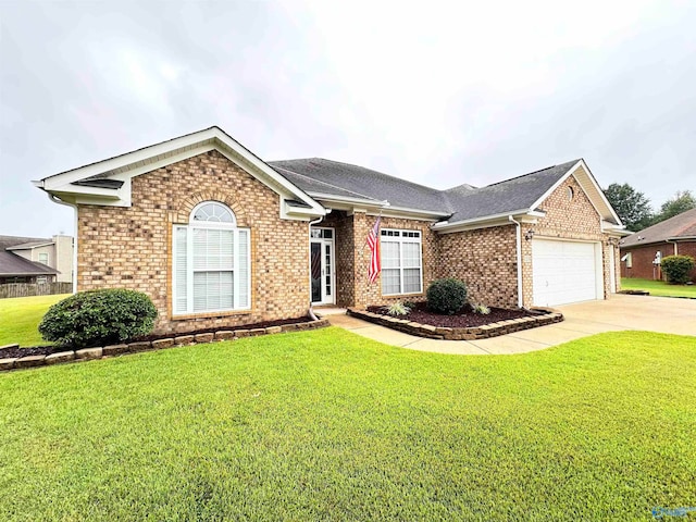 single story home featuring a garage and a front yard