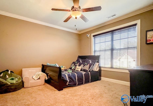 carpeted bedroom featuring ceiling fan and ornamental molding