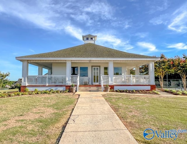 view of front of house with a porch and a front lawn