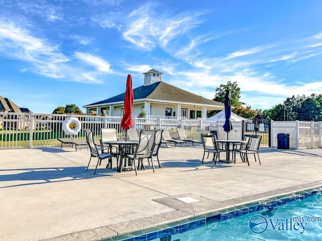 view of swimming pool with a patio