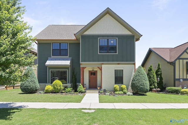 1530 Trek St NE, Huntsville, AL 35811 - craftsman house with board and batten siding, a front yard, brick siding, and roof with shingles
