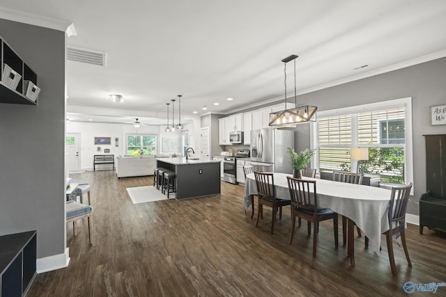 1530 Trek St NE, Huntsville, AL 35811 - dining space with crown molding, a ceiling fan, dark wood finished floors, recessed lighting, and baseboards