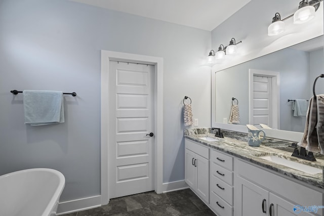 1530 Trek St NE, Huntsville, AL 35811 - full bath with baseboards, double vanity, and a freestanding tub