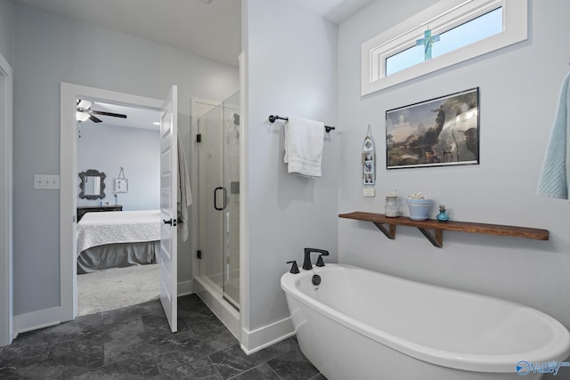 1530 Trek St NE, Huntsville, AL 35811 - ensuite bathroom featuring a freestanding bath, a stall shower, baseboards, and ceiling fan