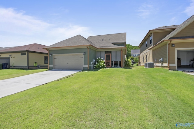 1530 Trek St NE, Huntsville, AL 35811 - view of front of property featuring a front lawn, an attached garage, concrete driveway, and a shingled roof