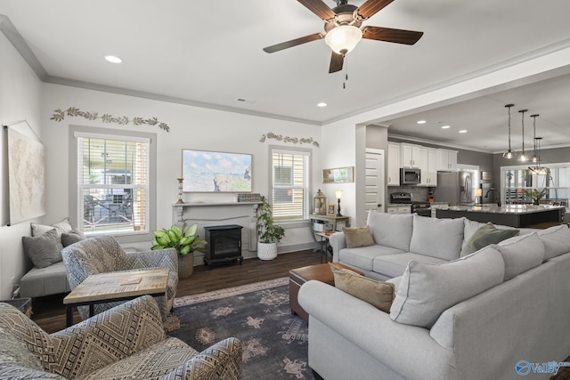 1530 Trek St NE, Huntsville, AL 35811 - living area with dark wood finished floors, a ceiling fan, ornamental molding, recessed lighting, and baseboards