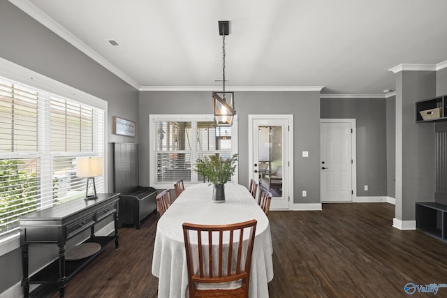1530 Trek St NE, Huntsville, AL 35811 - dining space featuring dark wood finished floors, crown molding, and baseboards