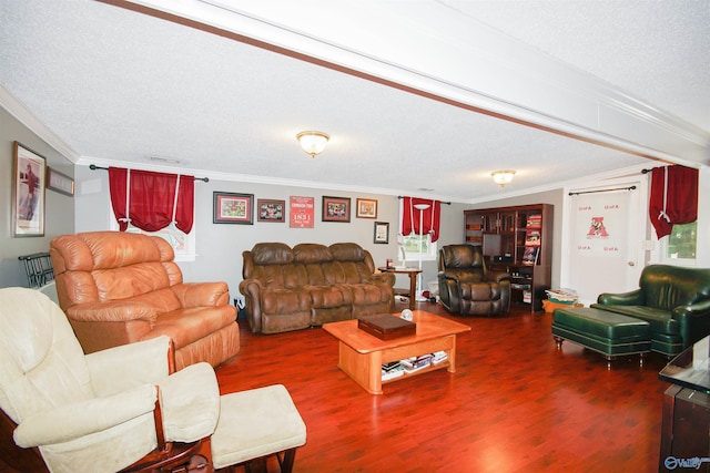 living room featuring ornamental molding, hardwood / wood-style floors, and a textured ceiling