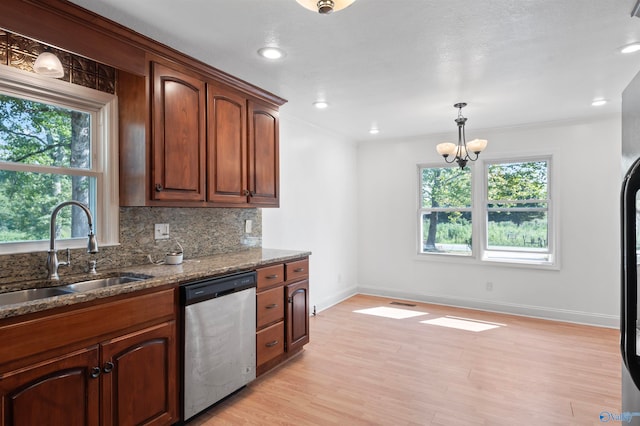 kitchen featuring dishwasher, decorative backsplash, sink, a notable chandelier, and light hardwood / wood-style floors