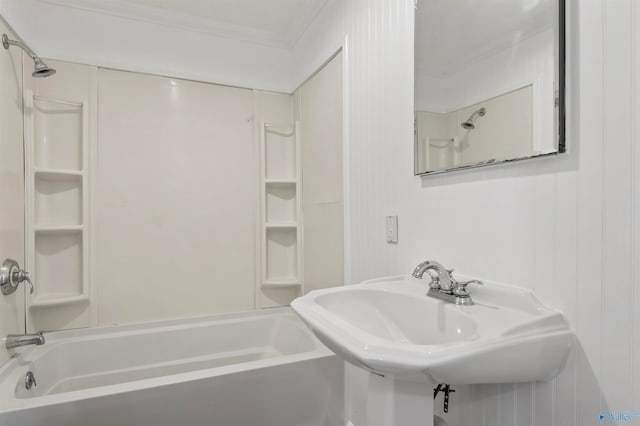 bathroom with ornamental molding, sink, and shower / bathtub combination