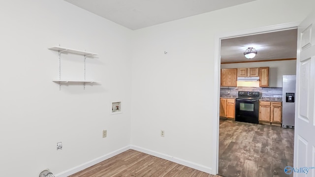 interior space featuring black electric range oven, open shelves, tasteful backsplash, wood finished floors, and stainless steel fridge with ice dispenser