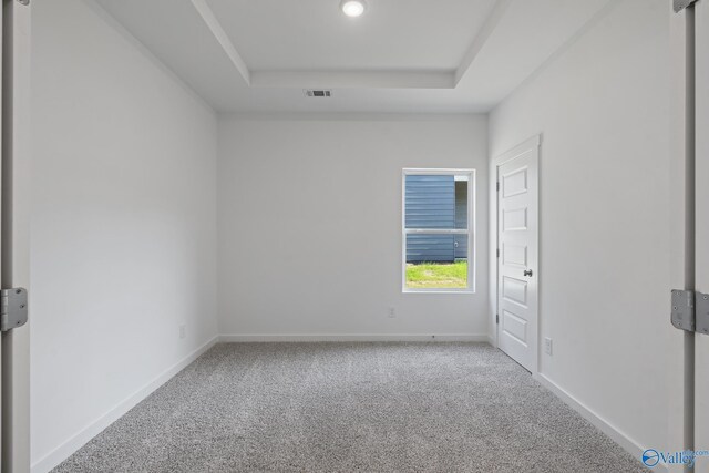 6219 Taramore Ln NW, Huntsville, AL 35806 - unfurnished room with carpet flooring, visible vents, a tray ceiling, and baseboards