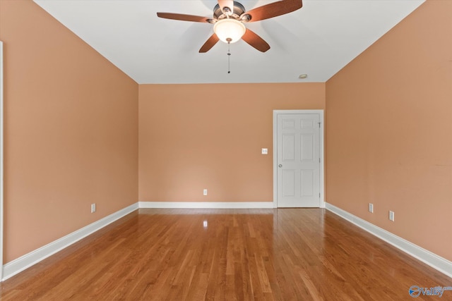 empty room featuring light wood-style floors, ceiling fan, and baseboards