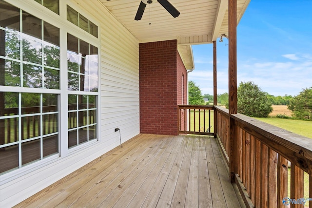 wooden terrace featuring ceiling fan