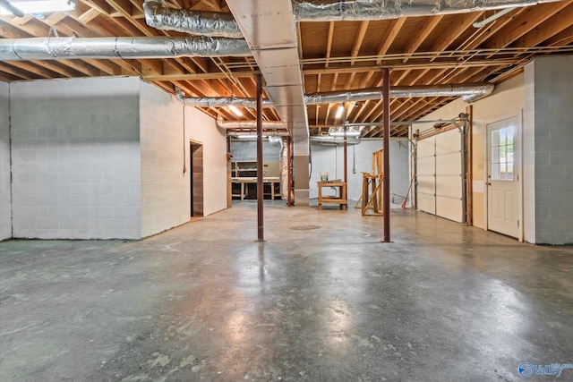 below grade area featuring concrete block wall