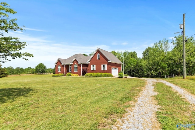 view of front of home with dirt driveway, a garage, and a front yard
