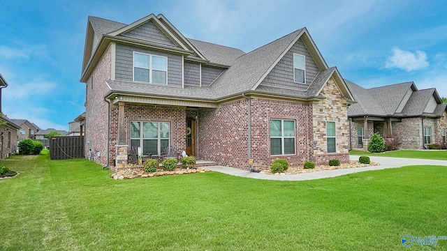 17583 Maree Dr, Athens, AL 35613 - craftsman house featuring roof with shingles, brick siding, and a front lawn