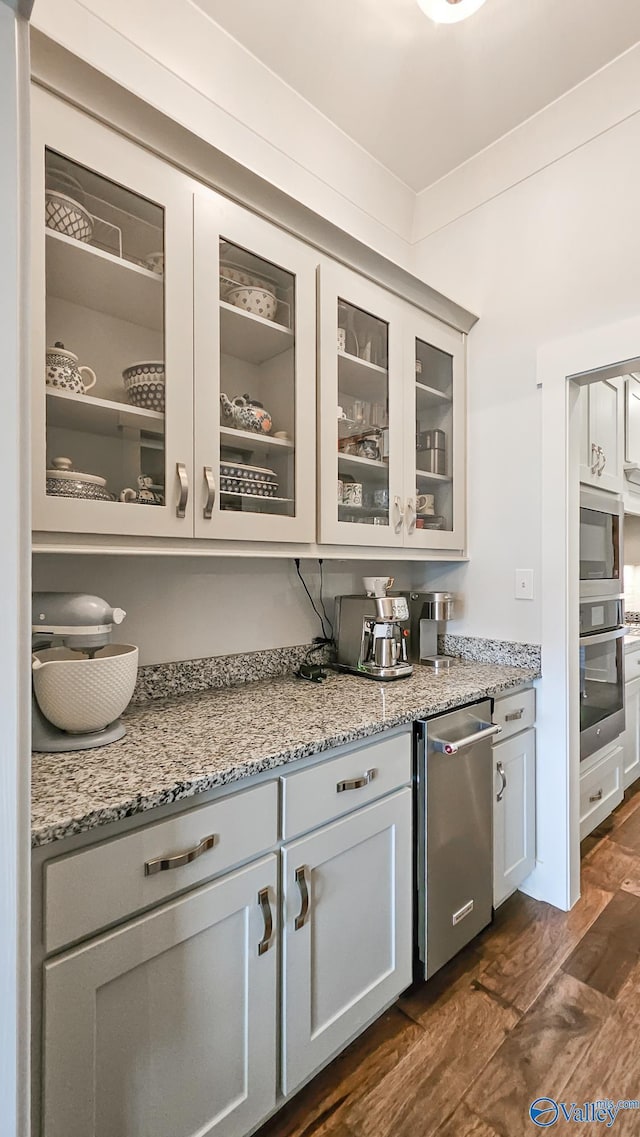 17583 Maree Dr, Athens, AL 35613 - bar featuring dark wood-style floors and appliances with stainless steel finishes