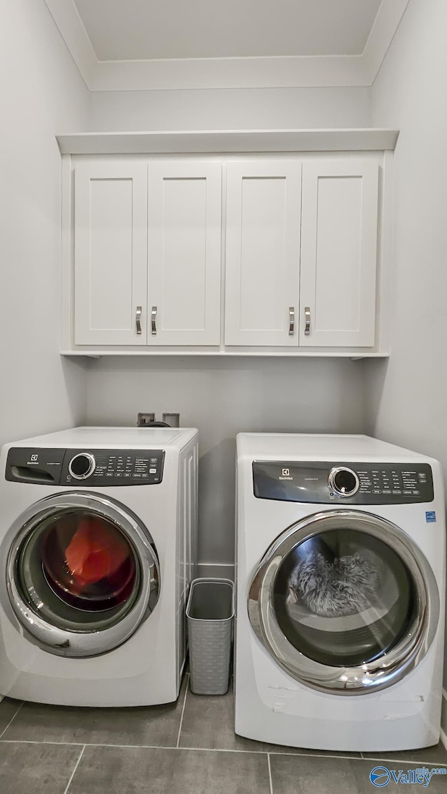 17583 Maree Dr, Athens, AL 35613 - clothes washing area featuring cabinet space, washing machine and dryer, and tile patterned flooring