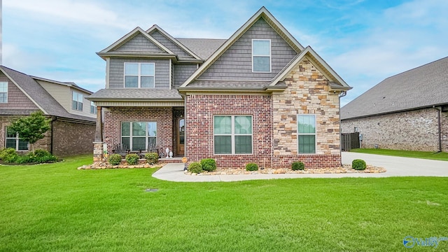 17583 Maree Dr, Athens, AL 35613 - craftsman house featuring central AC unit, stone siding, a front lawn, and brick siding