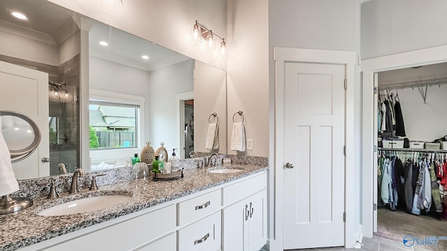 17583 Maree Dr, Athens, AL 35613 - full bathroom with a spacious closet, double vanity, and a sink