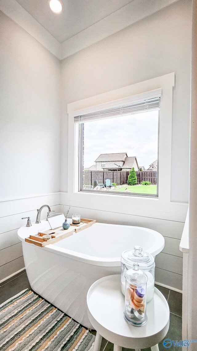 17583 Maree Dr, Athens, AL 35613 - full bathroom featuring tile patterned floors, a soaking tub, recessed lighting, and wainscoting