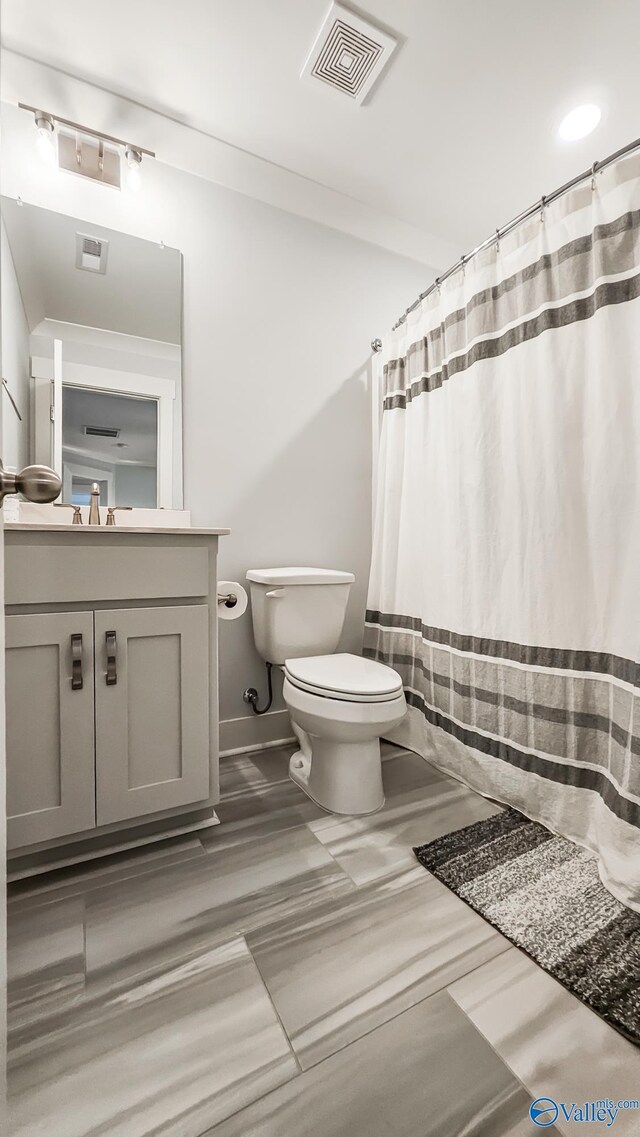 17583 Maree Dr, Athens, AL 35613 - bathroom with vanity, toilet, a shower with curtain, and visible vents
