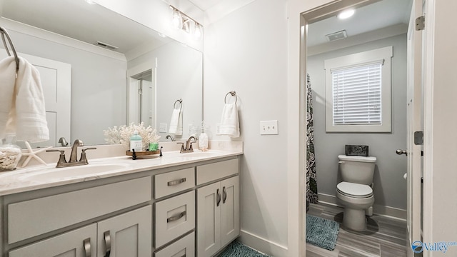 17583 Maree Dr, Athens, AL 35613 - full bathroom featuring baseboards, visible vents, double vanity, and a sink