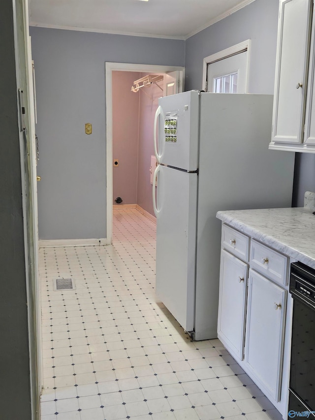 kitchen featuring light stone countertops, black dishwasher, white cabinetry, and ornamental molding