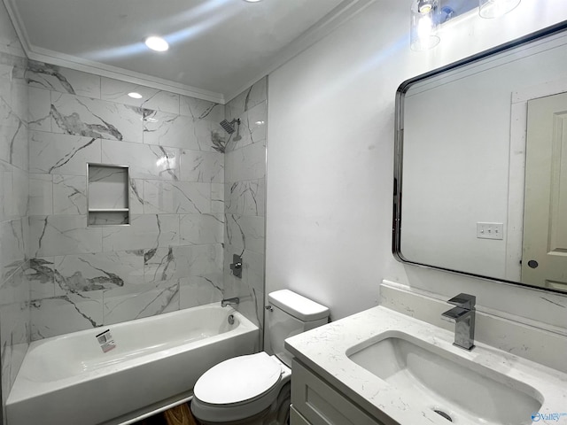 full bathroom featuring crown molding, toilet, vanity, and tiled shower / bath combo