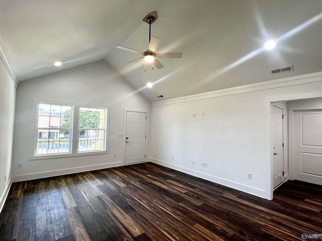 unfurnished room featuring ceiling fan, lofted ceiling, crown molding, and dark hardwood / wood-style flooring