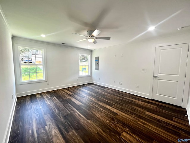 unfurnished room featuring a healthy amount of sunlight, ceiling fan, dark hardwood / wood-style floors, and crown molding