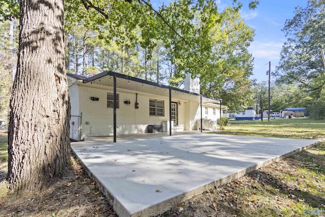 3374 Old Moulton Rd SW, Decatur, AL 35603 - rear view of house with brick siding and a chimney