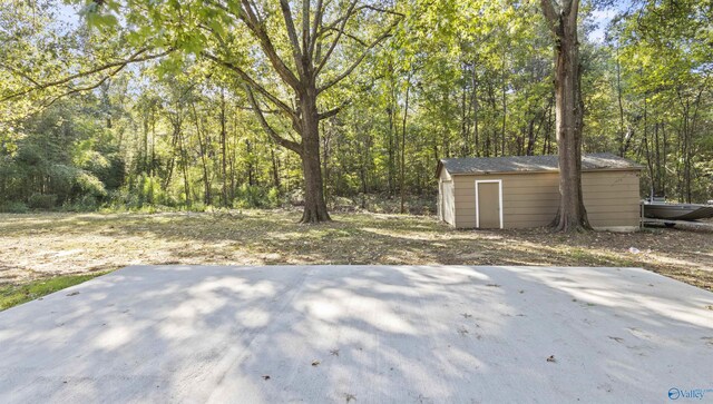 3374 Old Moulton Rd SW, Decatur, AL 35603 - view of patio / terrace with a shed and a wooded view