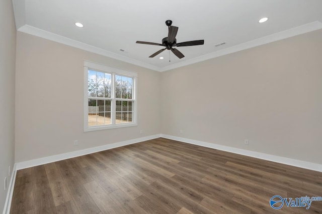 unfurnished room with ornamental molding, dark wood-type flooring, and ceiling fan