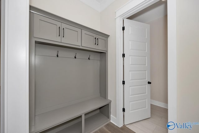 mudroom with light hardwood / wood-style floors