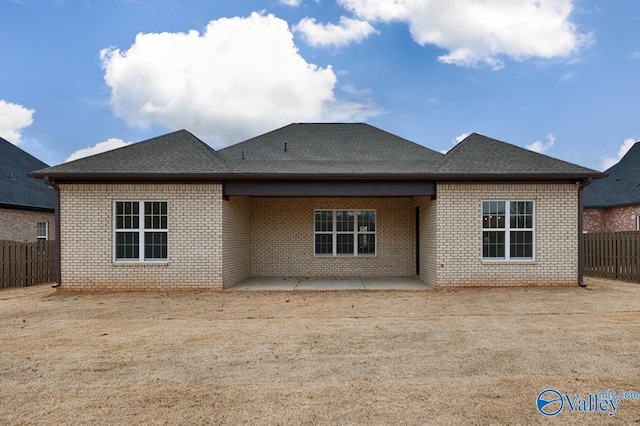 back of property with a patio area