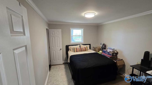 bedroom featuring crown molding and baseboards