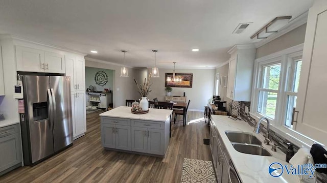 kitchen with a sink, gray cabinets, stainless steel refrigerator with ice dispenser, and dark wood finished floors